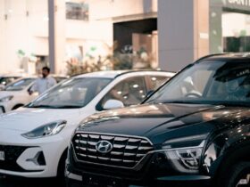 Photo of New Cars Parked in Front of a Car Dealership