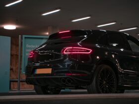 black and red car in a garage